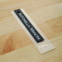 Plastic hanging label with cardboard and grommet "Antonella Mancini" 12,5x3 cm