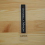 Plastic hanging label with cardboard and grommet "Antonella Mancini" 12,5x3 cm