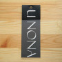 Cardboard tag with a plastic "Unona" 15,5x5,5 cm