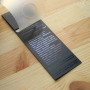 Cardboard tag with a plastic "Unona" 15,5x5,5 cm