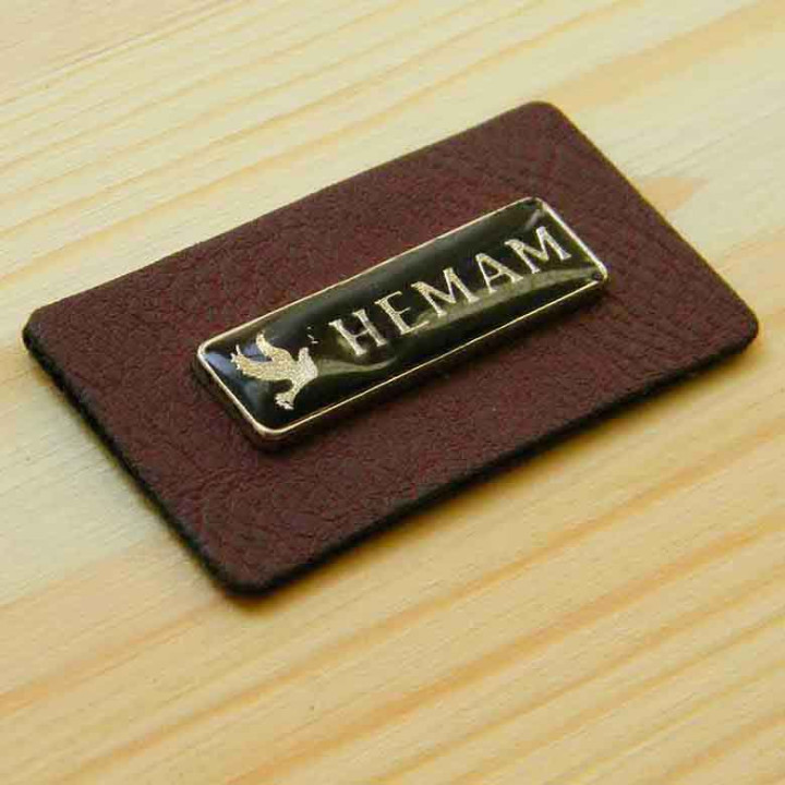 Leather label with metal logo "Hemam"