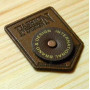 Leather label with rivet and patch