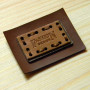 Leather label inset on the metal base