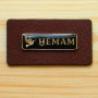 Leather label with metal logo "Hemam"