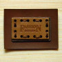 Leather label inset on the metal base