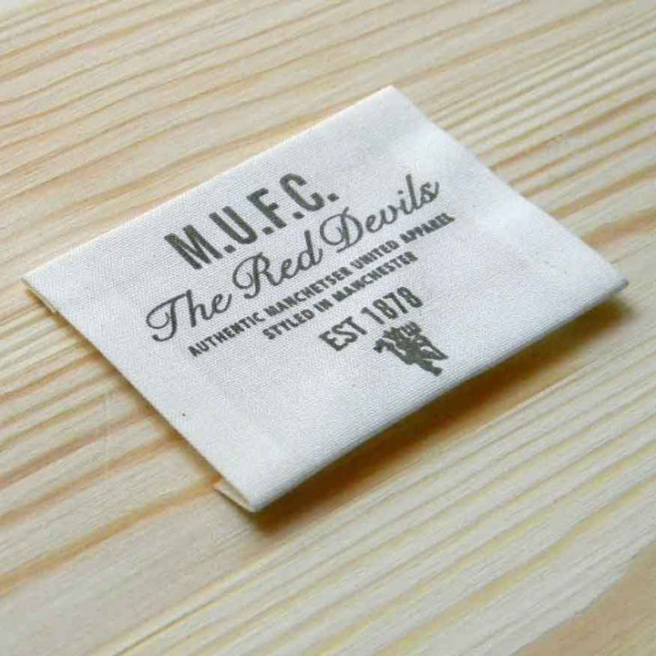 Этикетка из натуральной ткани "M.U.F.C." 6,5х5,5 см